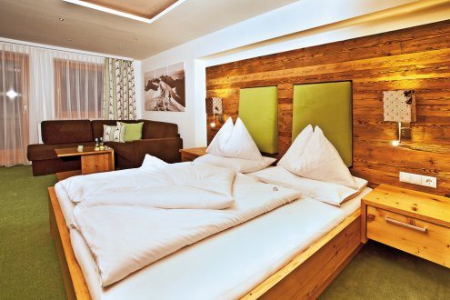 Die Zimmer Dachstein - eine gemütliche Kombination aus Altholz und Moderne.